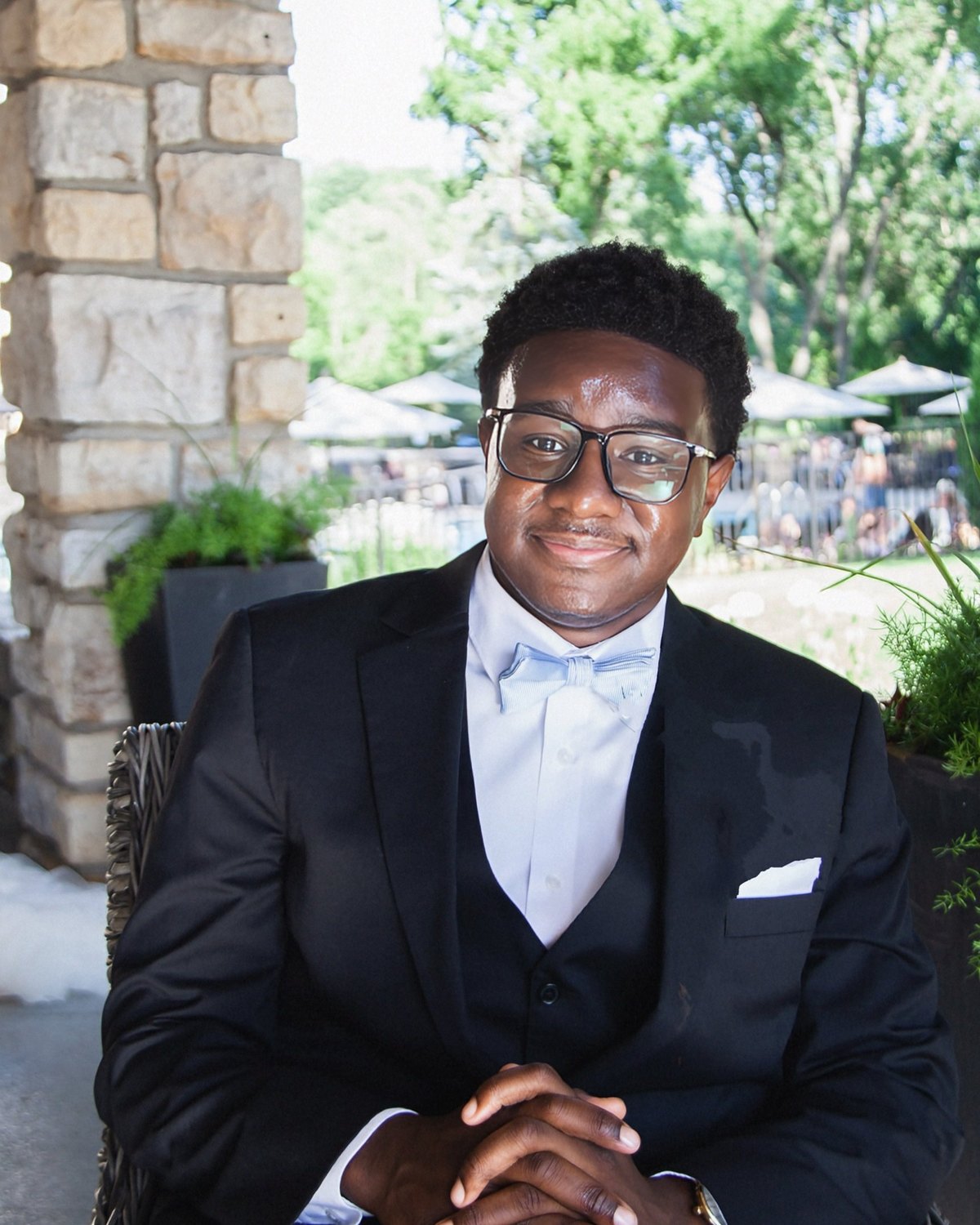 Chef Ace Cofield in a suit and bow tie, smiling